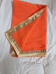 Vibrant Orange Saree with Mirror Work Border