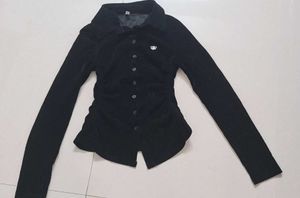 Chic Black Velvet Button-Up Top. Fitted shirt