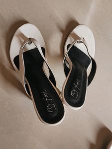 A Pair Of White Heels