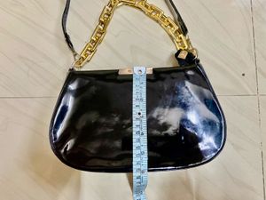 Chic Black Patent Handbag with Gold Chain