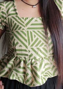 This is a light green crop top.