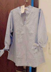 Chic Blue Cotton Top with Bow Sleeves