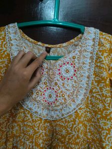 Yellow Printed Kurta with Neck Embellishment