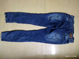 Ripped Blue Denim Jeans