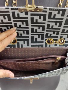 Qaeru FF Print Sling bag In Excellent Condition