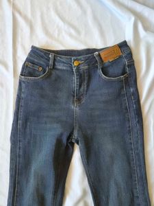 Flared Jeans with Studded Slits