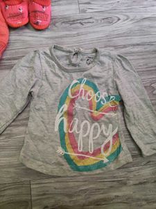 Bundle of baby clothes, beanie, shoes.