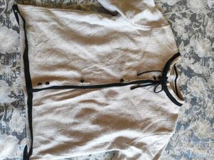 Chic Cream Knit Cardigan with Black Trim