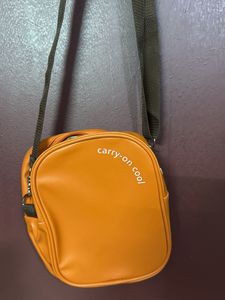 Orange "carry-on cool" crossbody bag