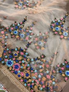 Powder blue floral net saree