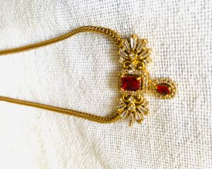 Elegant Gold Necklace with Red Stone
