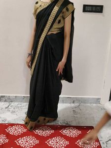 Elegant Black Saree with Gold Border