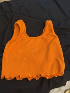 Orange Ribbed Lettuce Hem Crop Top
