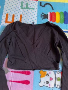 black crop to with long flared sleeves