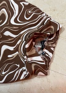 Brown graphic bootcut trousers