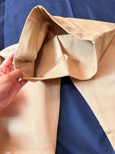 Elegant Beige Leggings with Embroidered Hem