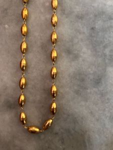 Elegant Gold Oval Bead Necklace