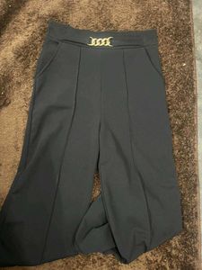 Stylish Wide-Legged Pants with Gold Chain Detail