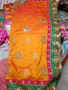 Vibrant Orange Silk Saree with Elephant Motifs