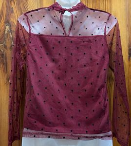 Polka dotted sheer top