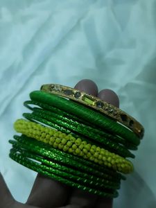 Set Of 13 Metal And Thread Fashion Bangles