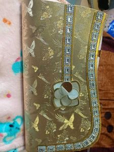 Elegant Gold Clutch with Bird Motif