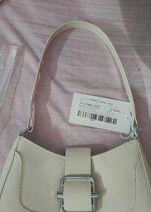 Beige sling bag