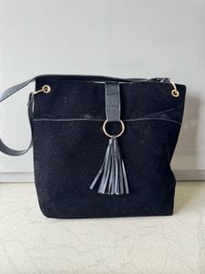 Chic Black Suede Shoulder Bag with Tassel Detail