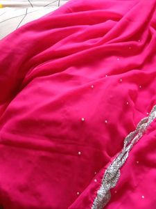 Vibrant Pink Saree with Pearl Embellishments