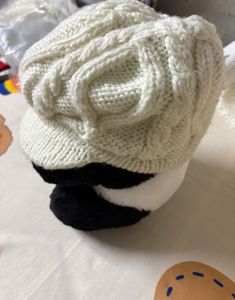 creamy-white knit,  textured cable pattern