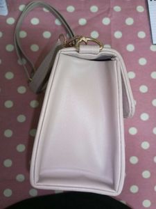 Stylish Beige Handbag with “H” Logo