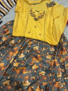 Yellow Embroidered kurta with skirt