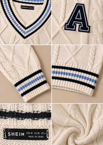 IVORY CABLE-KNIT VARSITY V-NECK SWEATER