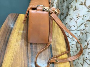 Chic Brown Crossbody Bag with Perforated Design