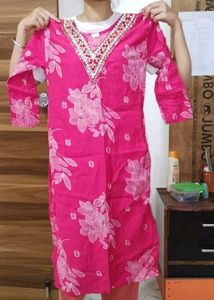 A pink floral Kurta set with pants and dupatta