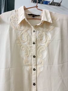 Elegant Cream Embroidered Sleeveless Blouse
