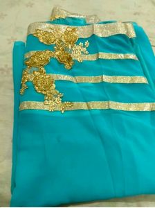 Stunning Teal Saree with Gold Embellishments