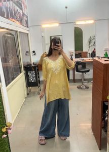Chic Casual Yellow Kurti with Delicate White Threa