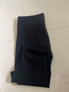 High-Waisted Black Pants with Button Detail