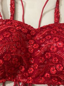 red backless blouse