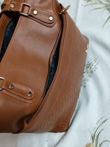 "Carry your essentials in style with this Handbag"