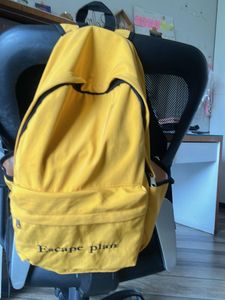 Yellow Backpack with "Escape plan" Text