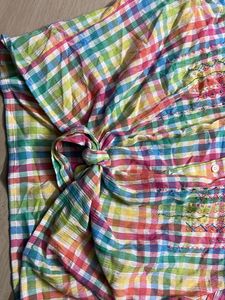 multicoloured shirt with a tie knot