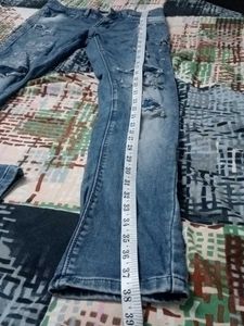 Distressed Blue Denim Jeans