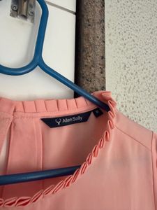 Chic Peach Ruffled Neck Top