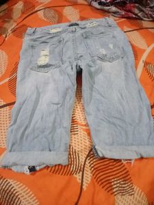 Distressed Light Wash Denim Capris