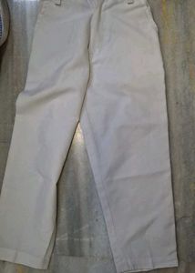 short-sleeve blue  striped  shirt  and white trous
