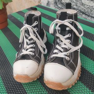 Converse High-Top Sneakers.