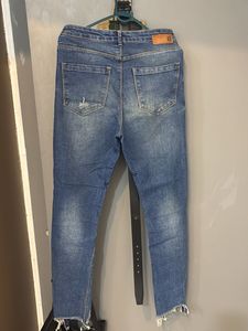 Distressed Blue Denim Jeans