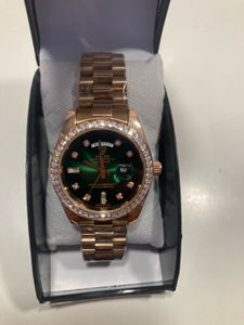 Rose Gold Rolex Watch with Green Dial